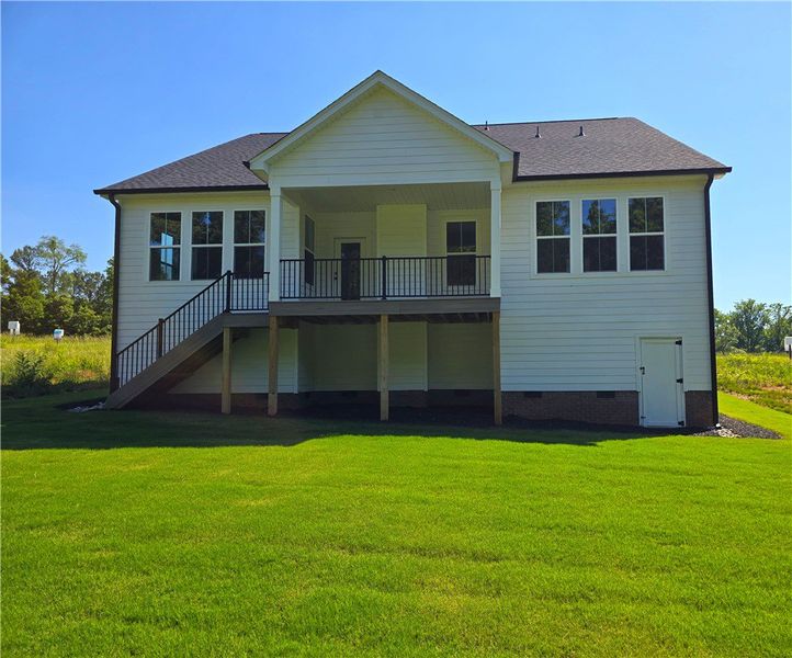 Enjoy outdoor living with a spacious deck and stai