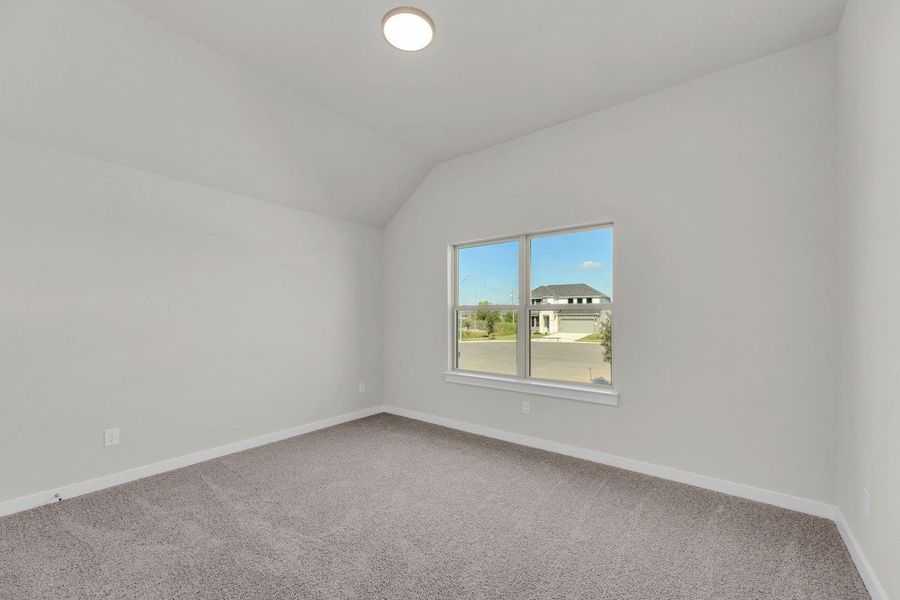 Bedroom in the Pecos home plan by Trophy Signature Homes – REPRESENTATIVE PHOTO