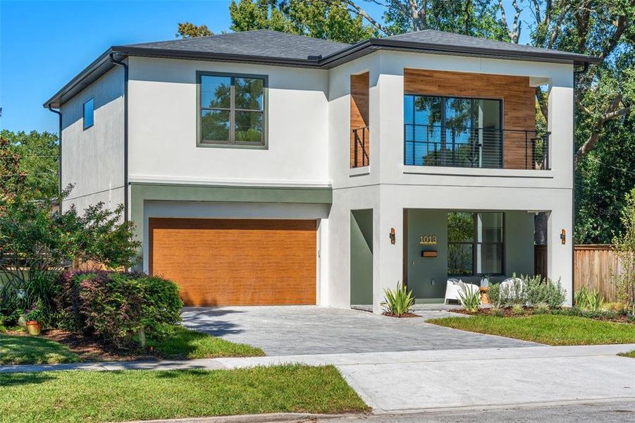 Front exterior of a new home in , Orlando, FL, highlighting curb appeal (Image 1).
