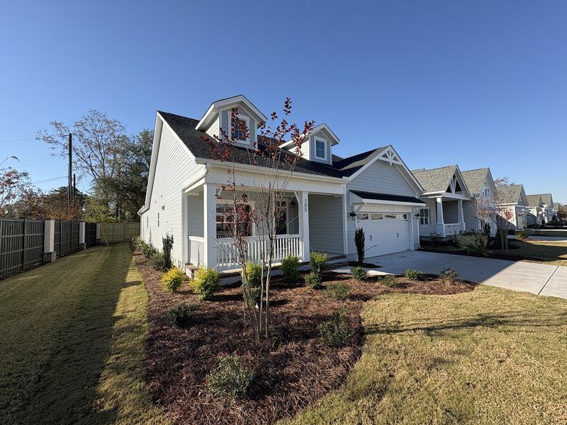 Front exterior of a new home in Riverside Cove, Wilmington, NC, highlighting curb appeal (Image 2).