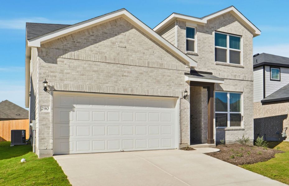 Front exterior of a new home in Sunfield, Buda, TX, highlighting curb appeal (Image 1). Front exterior of a new home in Sunfield, Buda, TX, highlighting curb appeal (Image 1).
