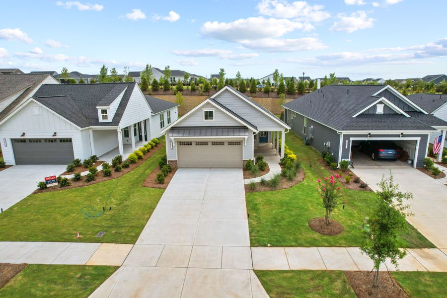Front exterior of a new home in Carolina Riverside, Belmont, NC, highlighting curb appeal (Image 28). Front exterior of a new home in Carolina Riverside, Belmont, NC, highlighting curb appeal (Image 28).