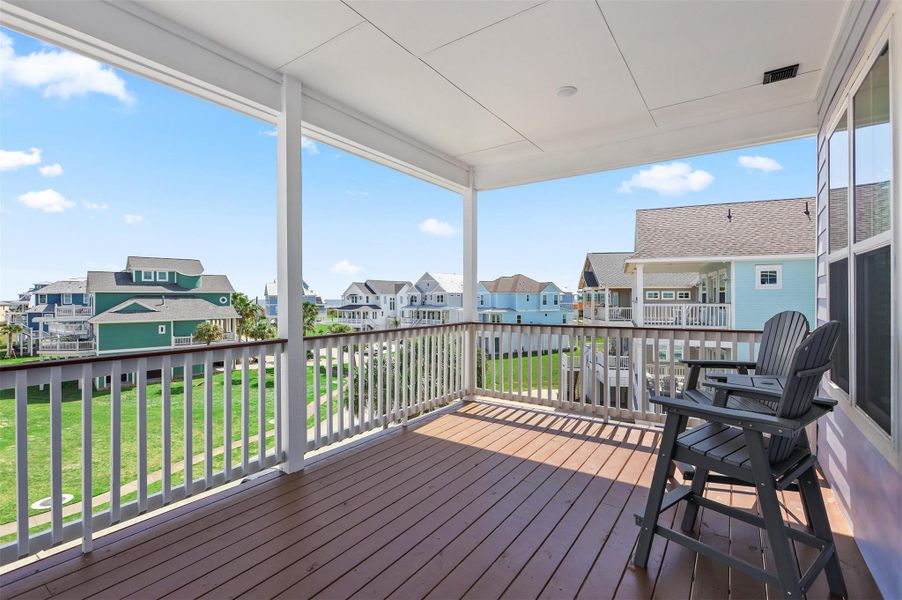 Step onto the second-floor balcony overlooking the front yard and enjoy wide views of the Pointe West community, with plenty of space to relax and soak in the Gulf breezes.