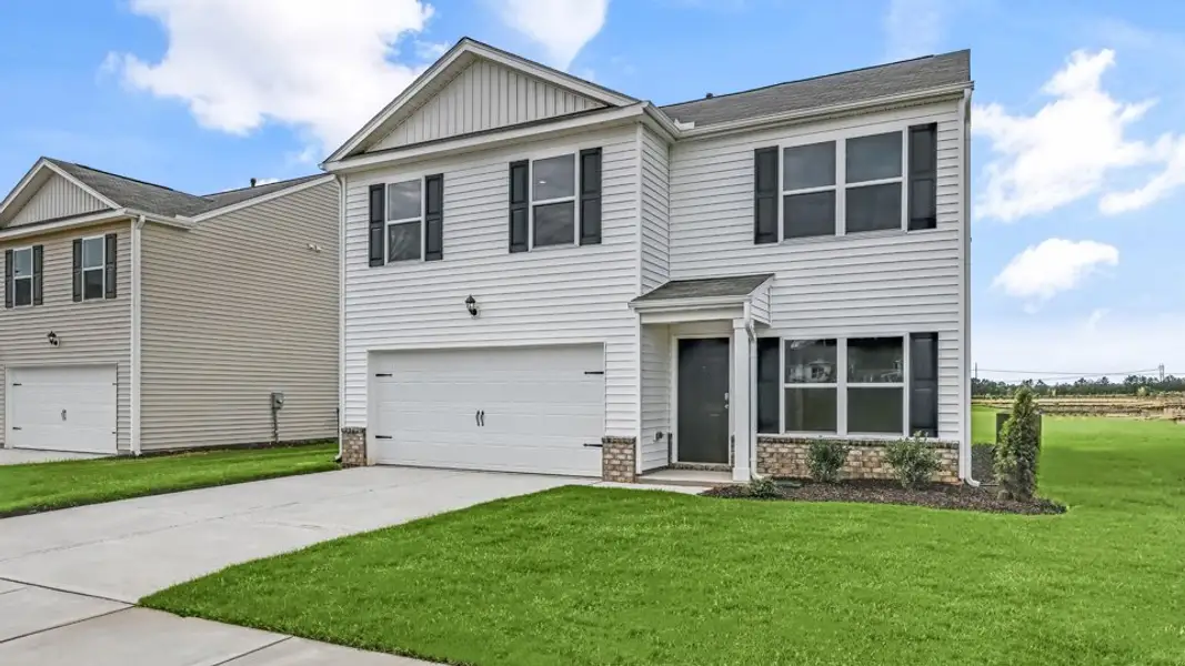 Front exterior of a new home in Laurel Oaks, Sanford, NC, highlighting curb appeal (Image 2). Front exterior of a new home in Laurel Oaks, Sanford, NC, highlighting curb appeal (Image 2).