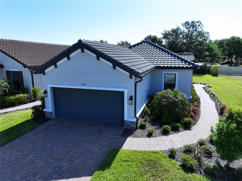 Front exterior of a new home in , Wesley Chapel, FL, highlighting curb appeal (Image 30).