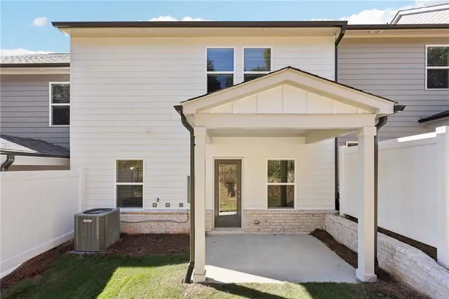 Exterior details and patio area of a home in Eastlyn Crossing, Flowery Branch (Image 4).