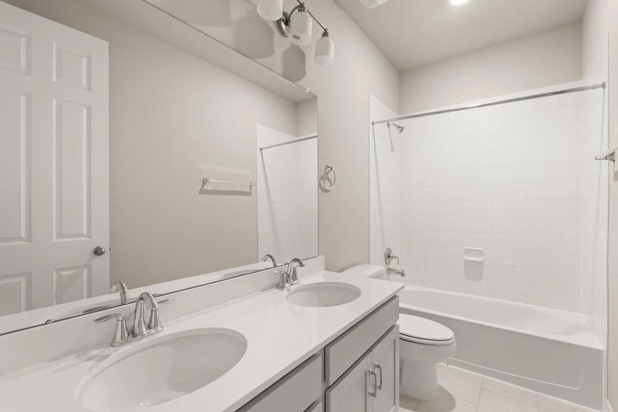 Secondary bathroom. Sample product photo. Actual exterior and interior selections may vary by homesite. Photo may be virtually staged.