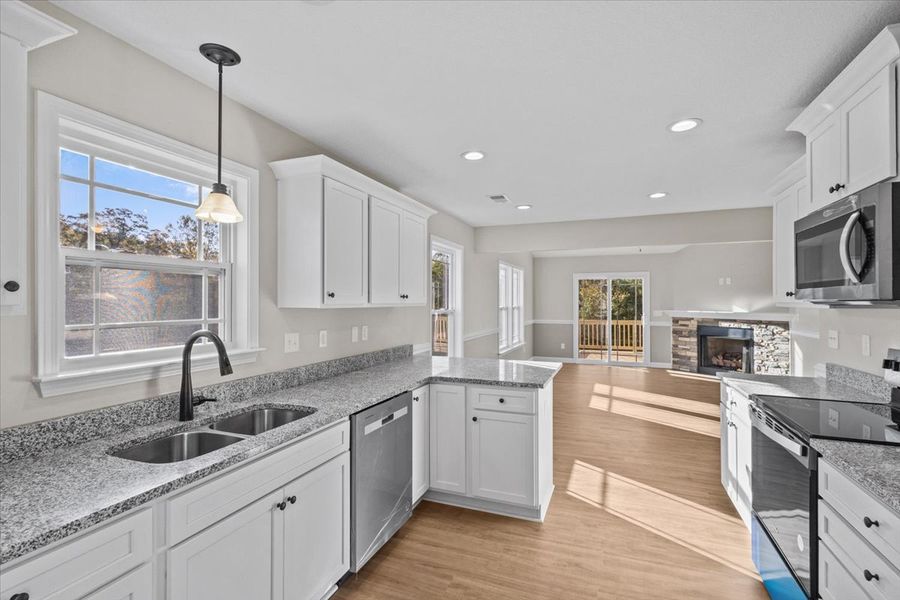 Representative furnished interior of a home built from the Iris by Enchanted Homes in Hampshire Heights, Moore (Image 5).