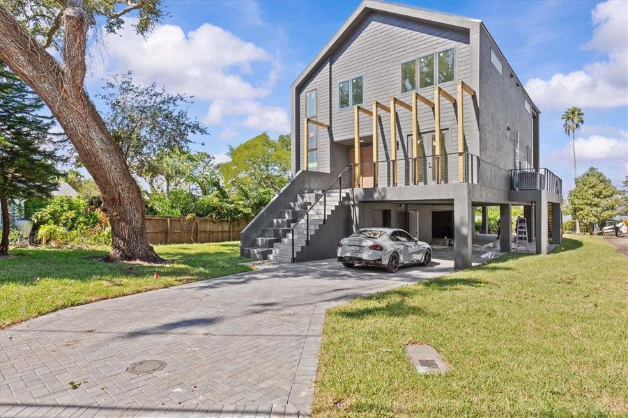 Front exterior of a new home in , Clearwater, FL, highlighting curb appeal (Image 21).