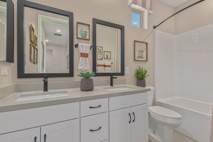 Representative furnished interior of a home built from the 2257 by Elliott Homes in Acacia at Santana, Yuma (Image 29).