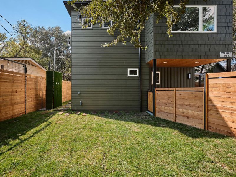 View of home's exterior with a gate View of home's exterior with a gate