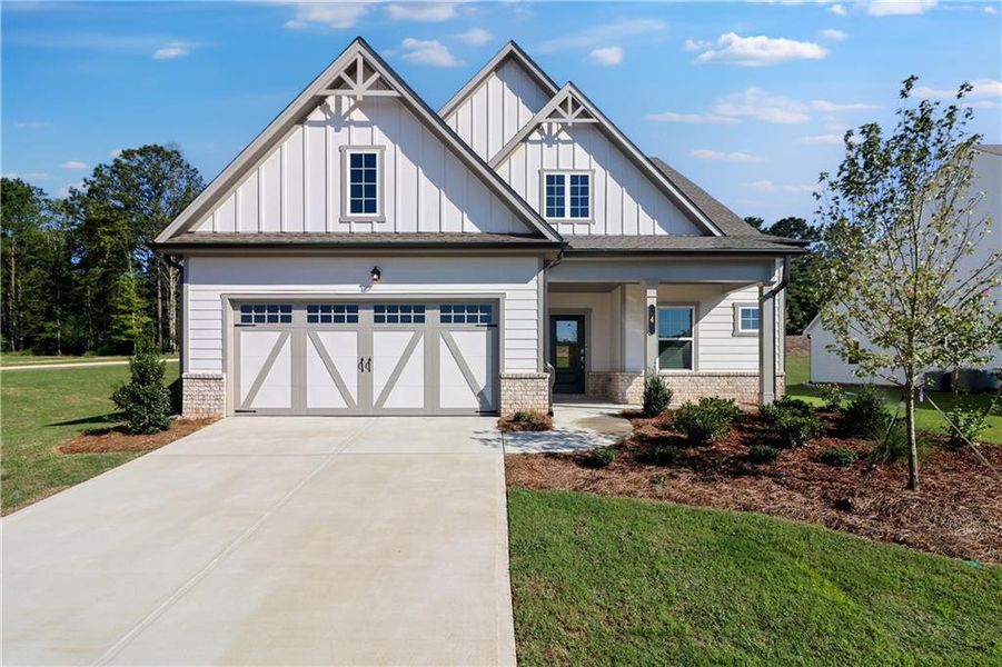 Front exterior of a new home in Twelve Parks 55+, Sharpsburg, GA, highlighting curb appeal (Image 23). Front exterior of a new home in Twelve Parks 55+, Sharpsburg, GA, highlighting curb appeal (Image 23).