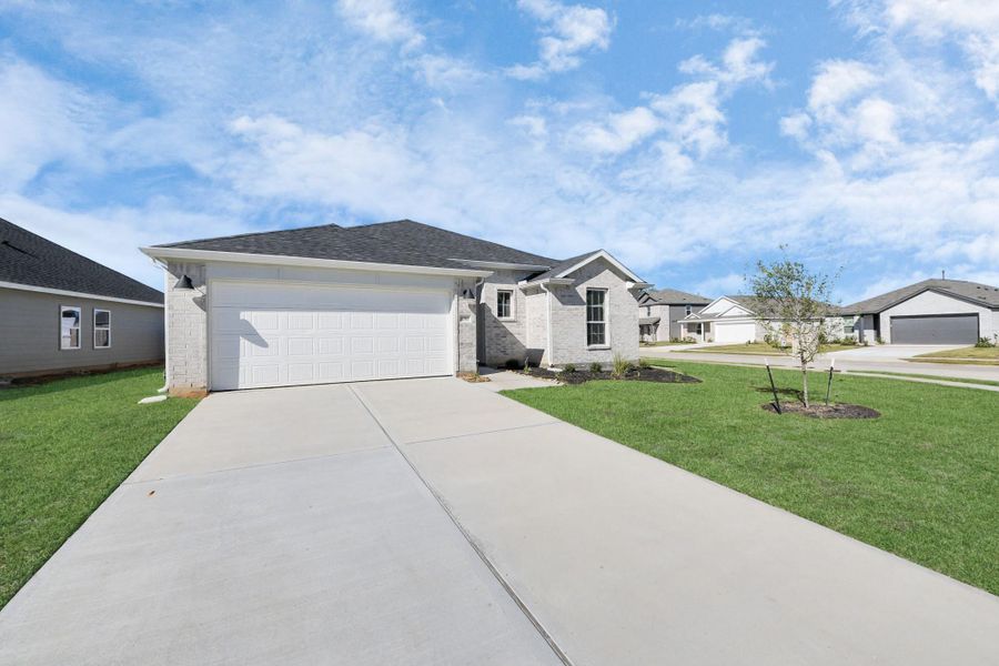Front exterior of a new home in Grand Oaks Reserve, Cleveland, TX, highlighting curb appeal (Image 26).