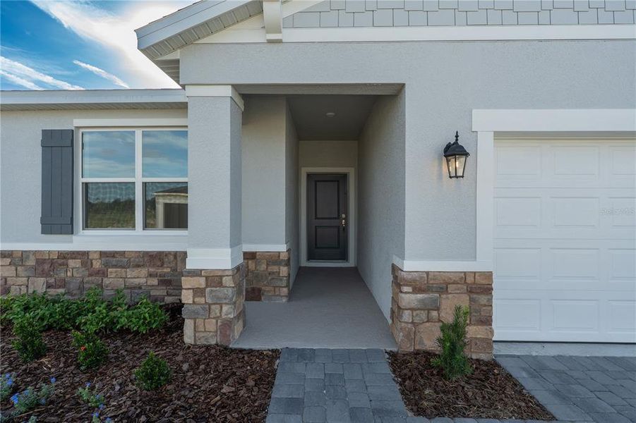 Exterior details and patio area of a home in Groves at Whitemarsh, Leesburg (Image 20).