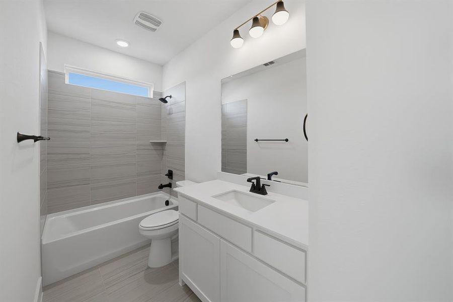 Full bathroom featuring shower / washtub combination and vanity Full bathroom featuring shower / washtub combination and vanity