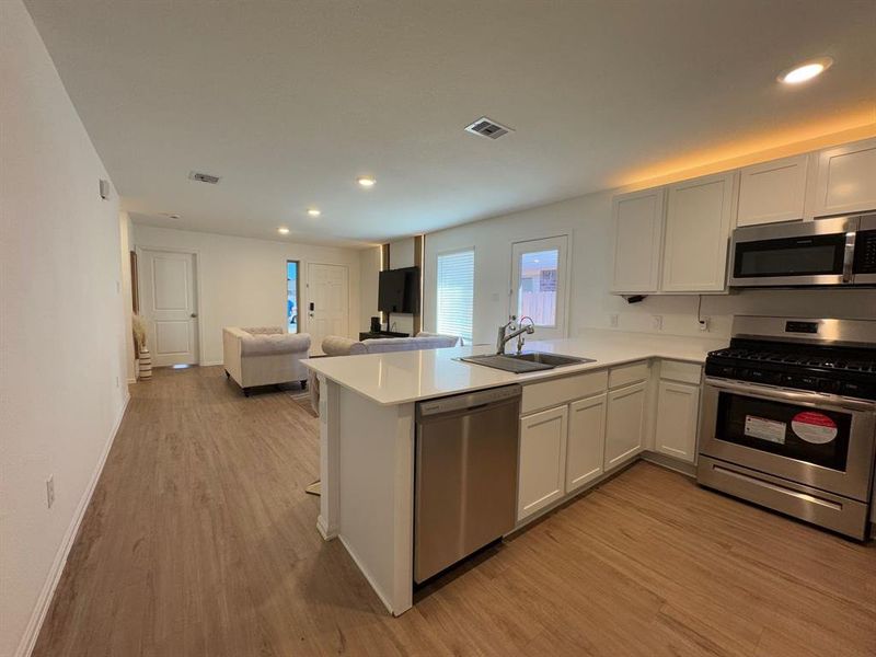 The kitchen flows into the family room.