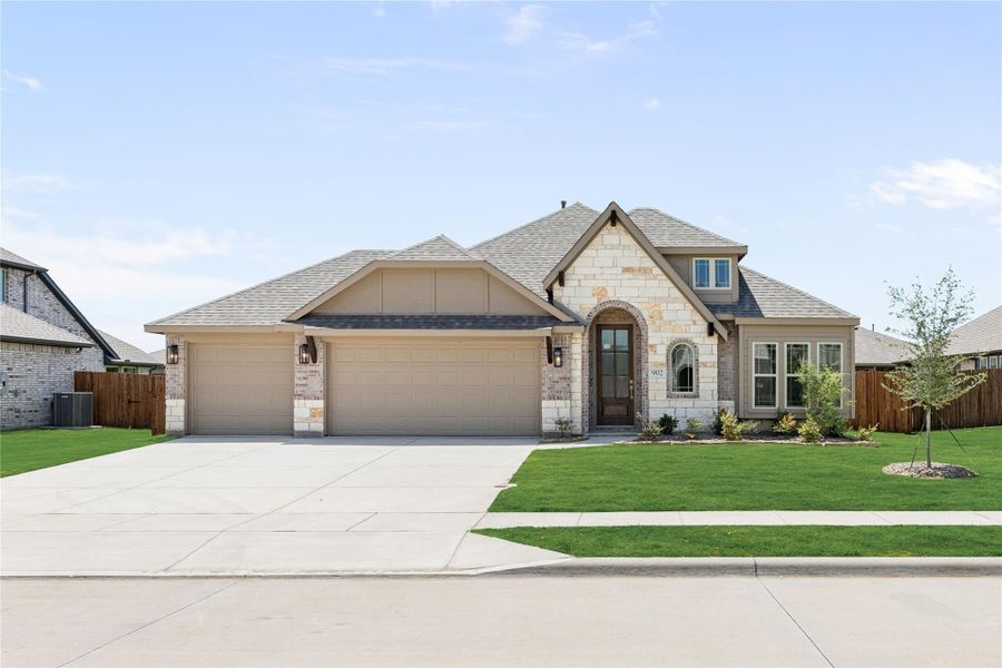 Single-story home with stone and brick exterior, three-car garage, arched entry, and manicured front lawn Single-story home with stone and brick exterior, three-car garage, arched entry, and manicured front lawn