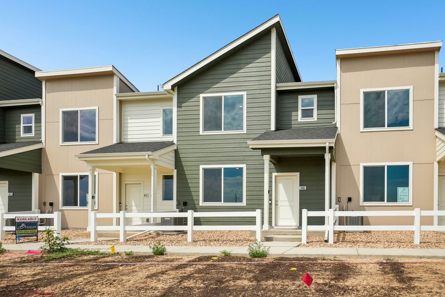 Front exterior of a new home in Liberty Draw, Evans, CO, highlighting curb appeal (Image 19).