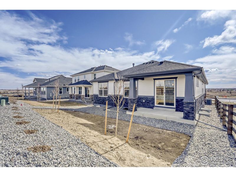 Exterior details and patio area of a home in Barefoot Lakes, Firestone (Image 3).