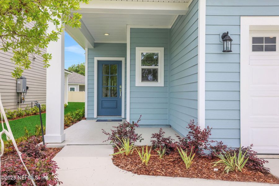 Front exterior of a new home in TrailMark, St. Augustine, FL, highlighting curb appeal (Image 28). Front exterior of a new home in TrailMark, St. Augustine, FL, highlighting curb appeal (Image 28).