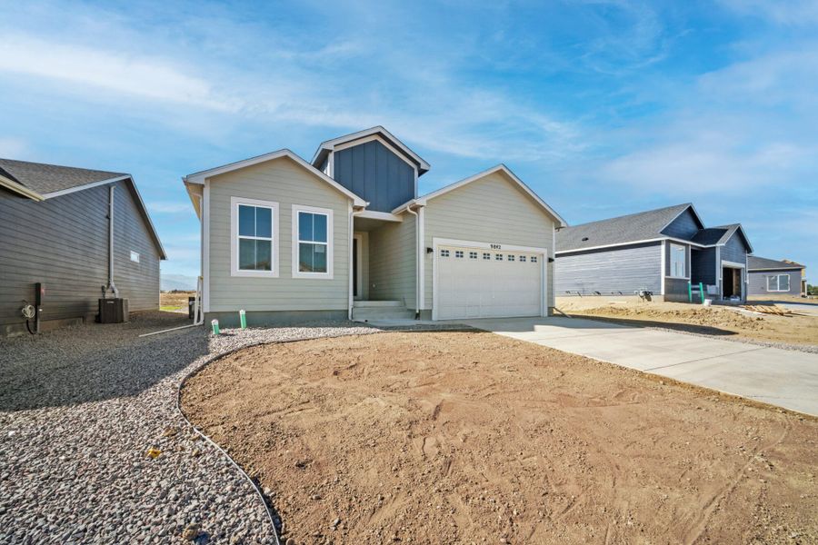 Front exterior of a new home in The Glen-12, Colorado Springs, CO, highlighting curb appeal (Image 27). Front exterior of a new home in The Glen-12, Colorado Springs, CO, highlighting curb appeal (Image 27).