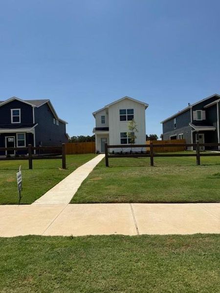 Front exterior of a new home in Valverde, Bastrop, TX, highlighting curb appeal (Image 2).