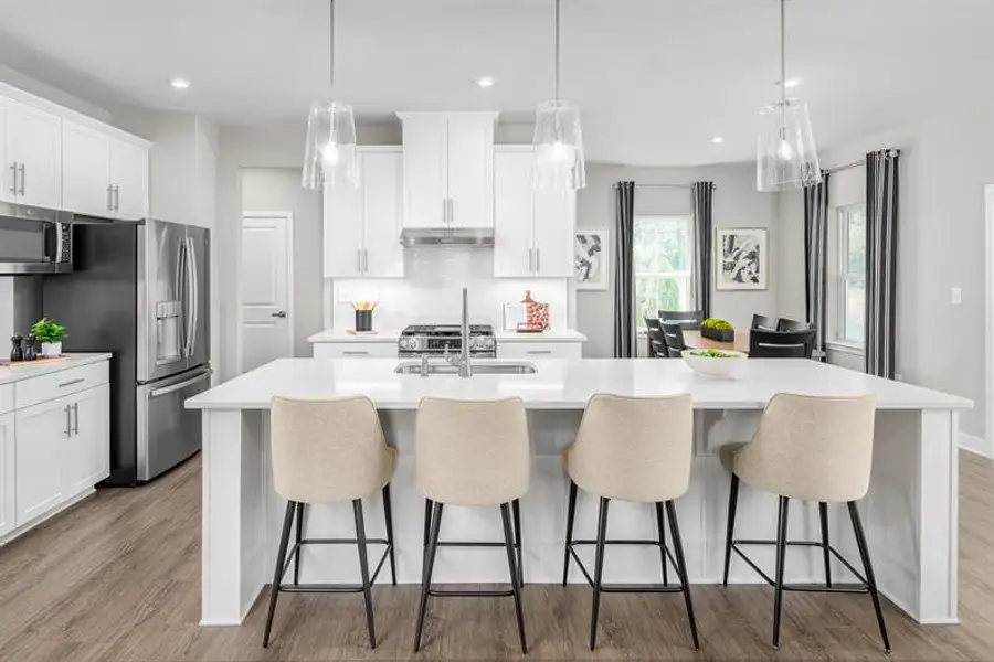 Representative furnished interior of a home built from the Columbia by Ryan Homes in Crystal Falls, Dawsonville (Image 1).