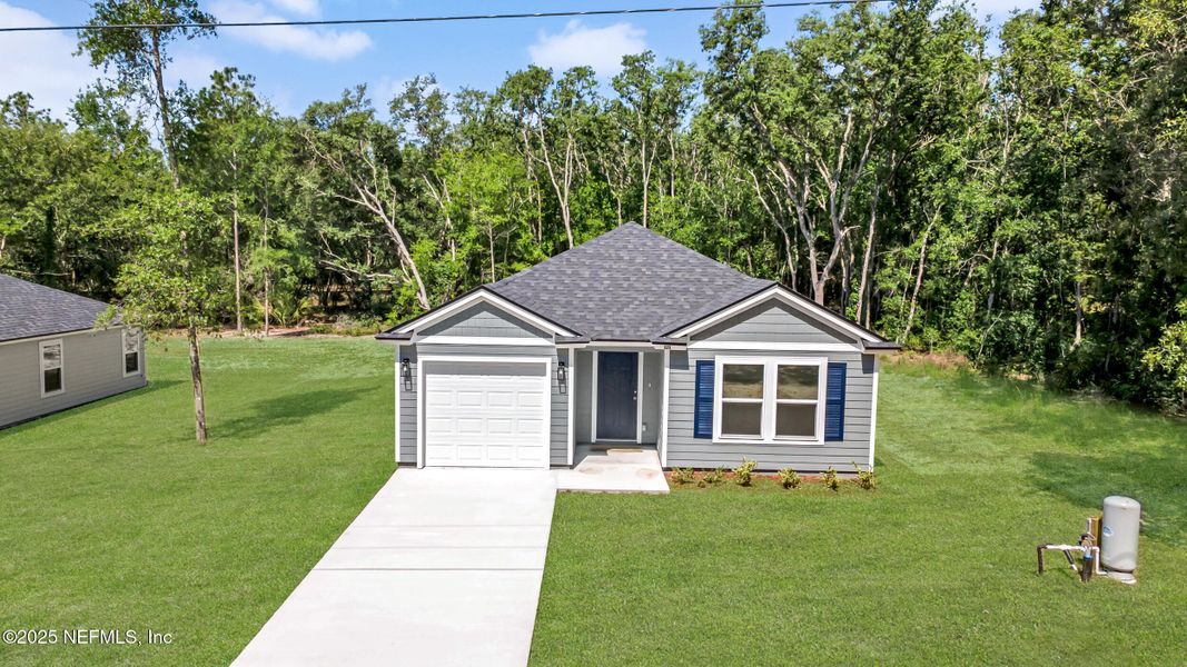 Front exterior of a new home in , Satsuma, FL, highlighting curb appeal (Image 2).