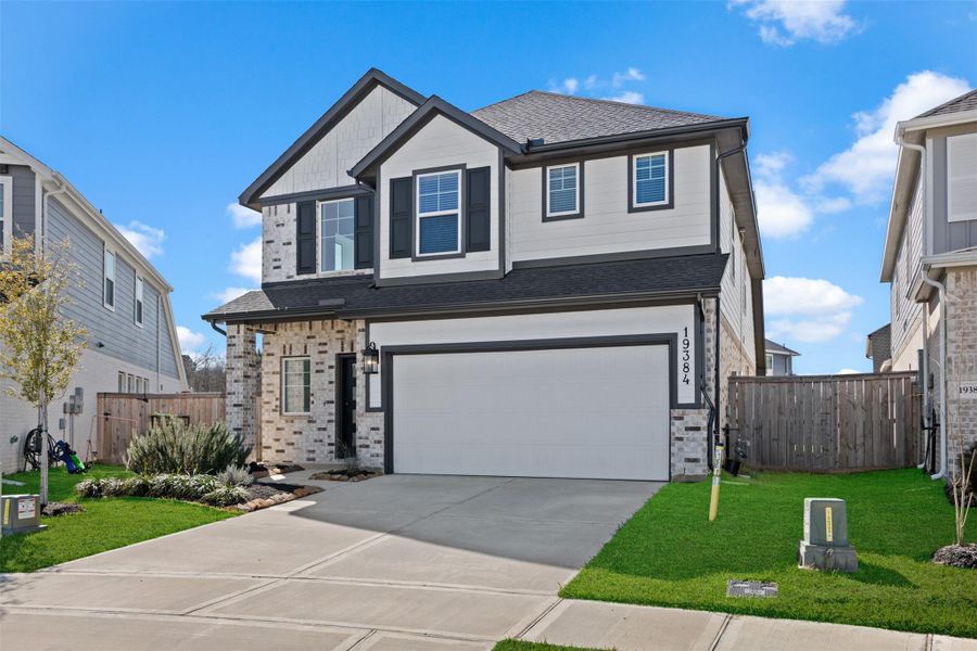 Front exterior of a new home in Emory Glen, Magnolia, TX, highlighting curb appeal (Image 17).