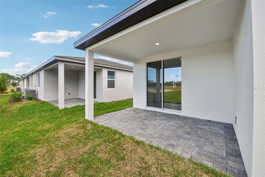 Exterior details and patio area of a home in Ridgehaven - Villas, Ormond Beach (Image 23).