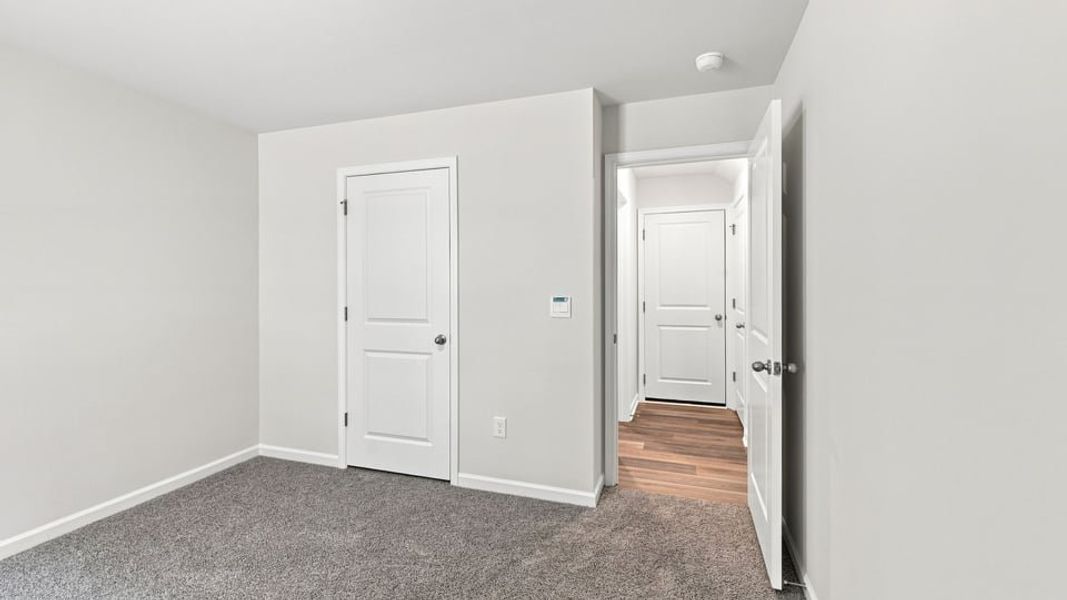 Spacious, unfurnished interior of a new home in Bentley Park, Greenwood (Image 23).