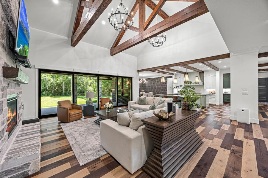 Bright and airy living room with dramatic beams and designer finishes. Bright and airy living room with dramatic beams and designer finishes.