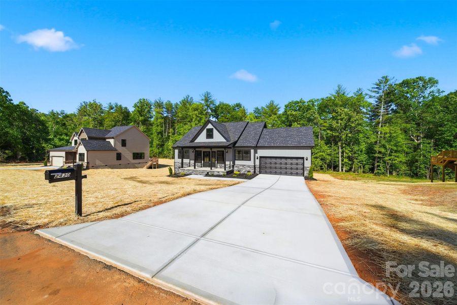 Front exterior of a new home in , Morganton, NC, highlighting curb appeal (Image 23).