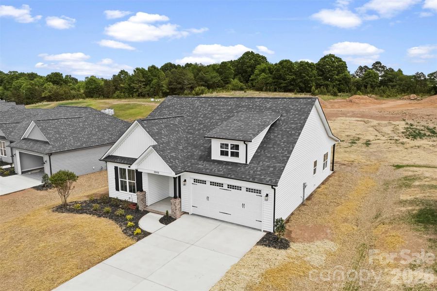 Front exterior of a new home in , Albemarle, NC, highlighting curb appeal (Image 21).