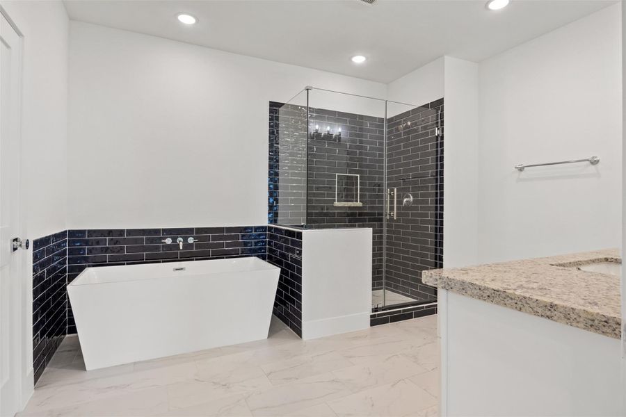 A bold yet balanced primary bath where masculine meets feminine—dual-tone finishes, and elevated design create a spa-like retreat that’s as stylish as it is serene.