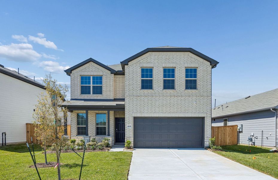 Front exterior of a new home in Mavera, Conroe, TX, highlighting curb appeal (Image 1). Front exterior of a new home in Mavera, Conroe, TX, highlighting curb appeal (Image 1).