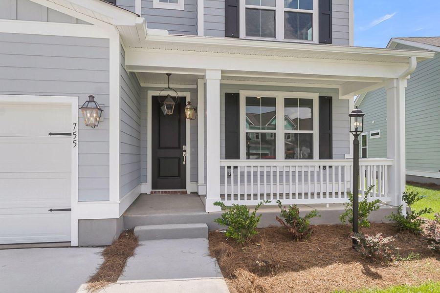 Exterior details and patio area of a home in Tidewater at Lakes of Cane Bay, Summerville (Image 24). Exterior details and patio area of a home in Tidewater at Lakes of Cane Bay, Summerville (Image 24).