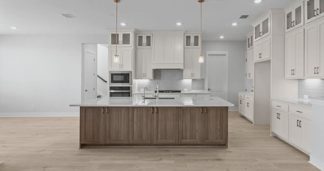 Representative furnished interior of a home built from the Raegan by Chesmar Homes in Sweetwater, Austin (Image 4).