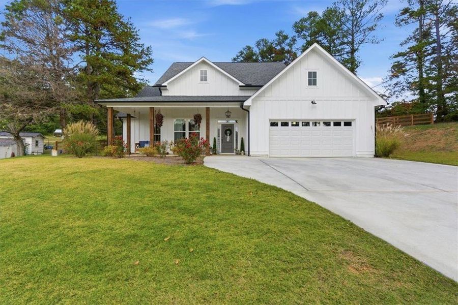 Front exterior of a new home in , Calhoun, GA, highlighting curb appeal (Image 24).