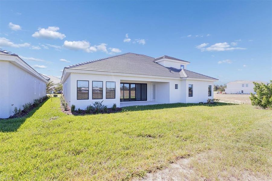 Exterior details and patio area of a home in Oakfield, Parrish (Image 24).