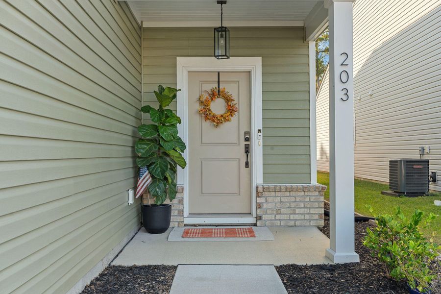 Exterior details and patio area of a home in Jasmine Point at Lakes of Cane Bay, Summerville (Image 4).