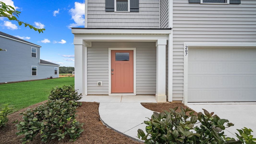 Front exterior of a new home in Holly Oaks, Statesboro, GA, highlighting curb appeal (Image 2).