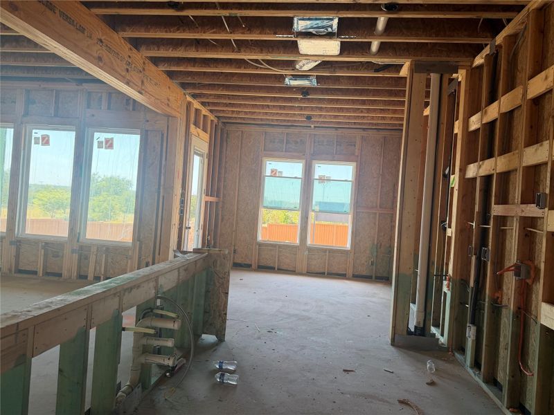 Exposed wood framing and subfloors highlight the open layout during this exciting construction phase.