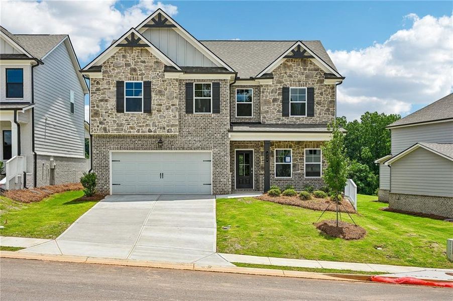 Front exterior of a new home in Fowler Farms, Auburn, GA, highlighting curb appeal (Image 26).
