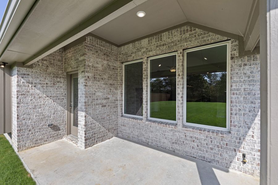 Exterior details and patio area of a home in The Reserve at Spiritas Ranch, Little Elm (Image 3).