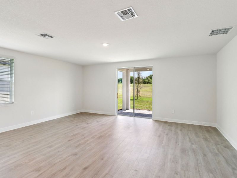 Spacious, unfurnished interior of a new home in The Reserve at Hammock Oaks - Signature Series, Lady Lake (Image 11).