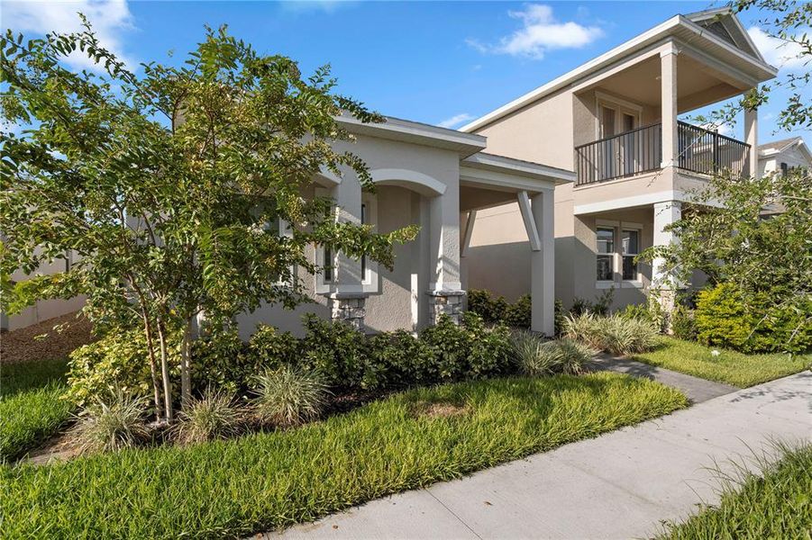 Front exterior of a new home in , Winter Garden, FL, highlighting curb appeal (Image 1).
