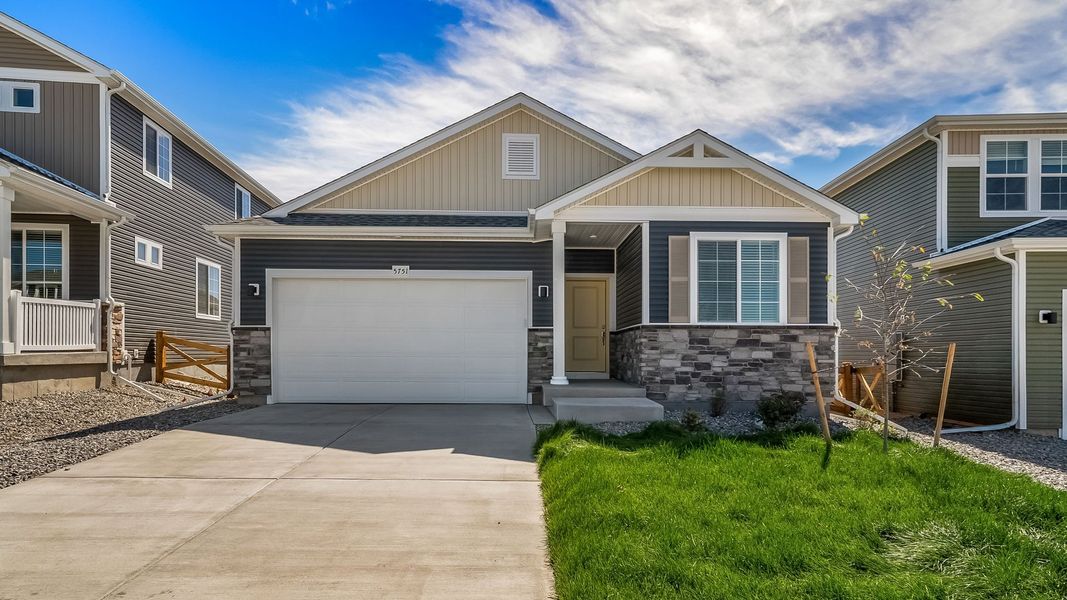 Front exterior of a new home in Banning Lewis Ranch, Colorado Springs, CO, highlighting curb appeal (Image 19). Front exterior of a new home in Banning Lewis Ranch, Colorado Springs, CO, highlighting curb appeal (Image 19).