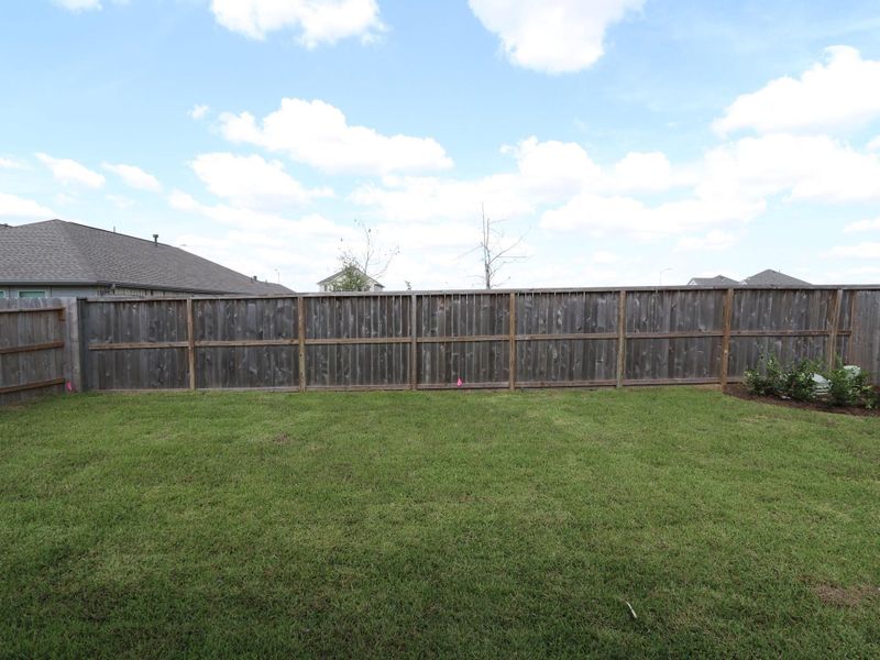 Front exterior of a new home in Miller's Pond, Rosenberg, TX, highlighting curb appeal (Image 10). Front exterior of a new home in Miller's Pond, Rosenberg, TX, highlighting curb appeal (Image 10).