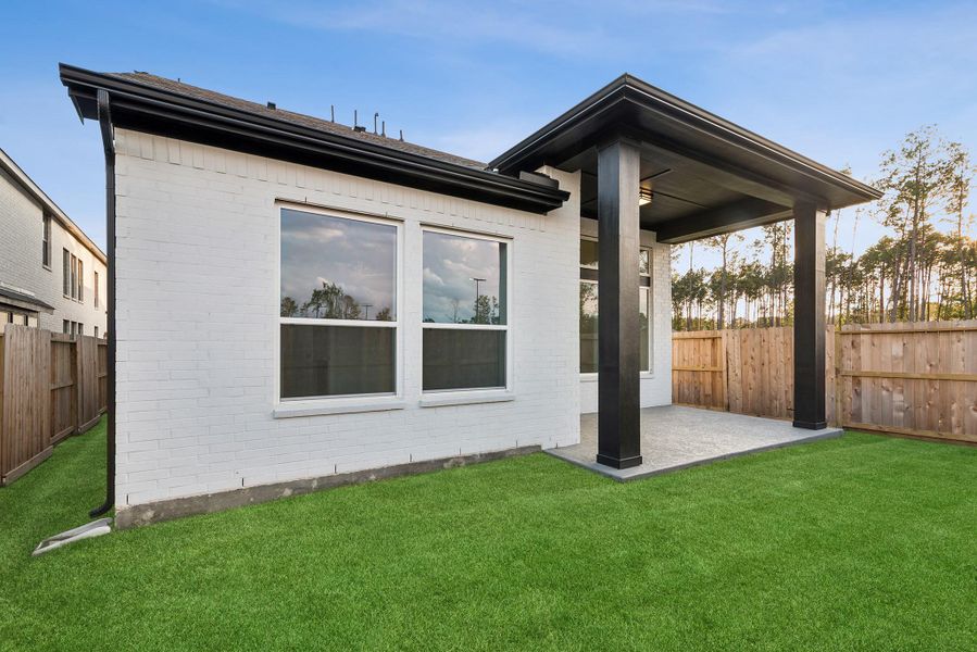 Exterior details and patio area of a home in The Highlands - Grove Collection, Porter (Image 3).